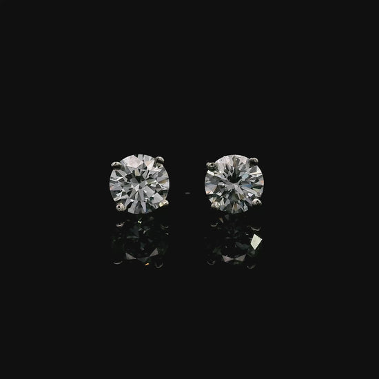 14K White gold stud earrings set with round brilliant diamonds. Item J39014 - ABC Jewelry Co. 