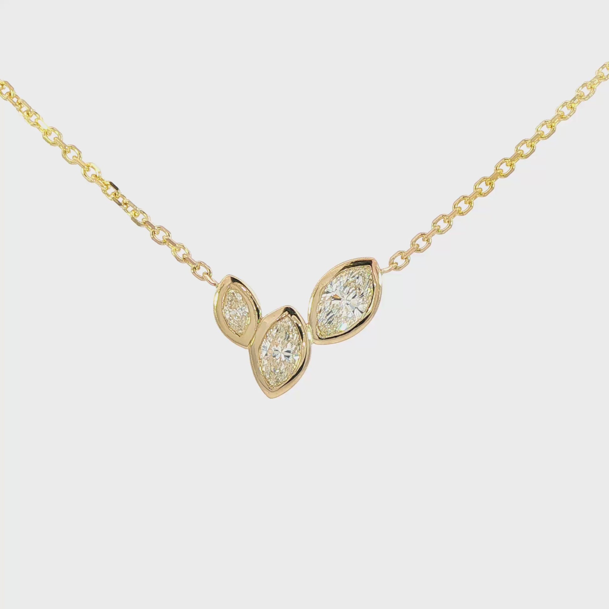 14K Yellow gold necklace set with three marquise diamonds. Item J38865 - ABC Jewelry Co. 