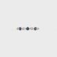 18K White gold band bezel set with blue sapphires and round brilliant diamonds. Item J36395 - ABC Jewelry Co. 