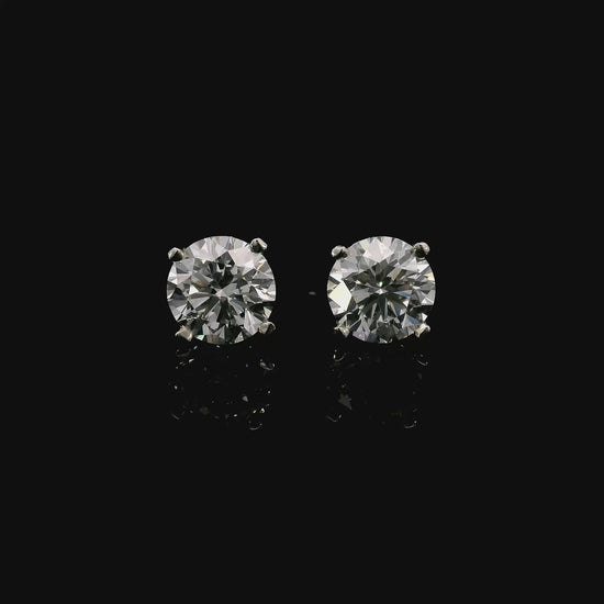 14K White gold stud earrings set with round brilliant diamonds. Item J37810 - ABC Jewelry Co.