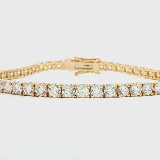 14K Yellow gold tennis bracelet set with round brilliant diamonds. Item J38986 - ABC Jewelry Co. 