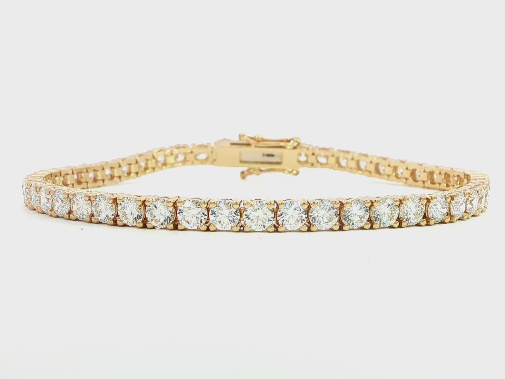 14K Yellow gold tennis bracelet set with round brilliant diamonds. Item J38986 - ABC Jewelry Co. 