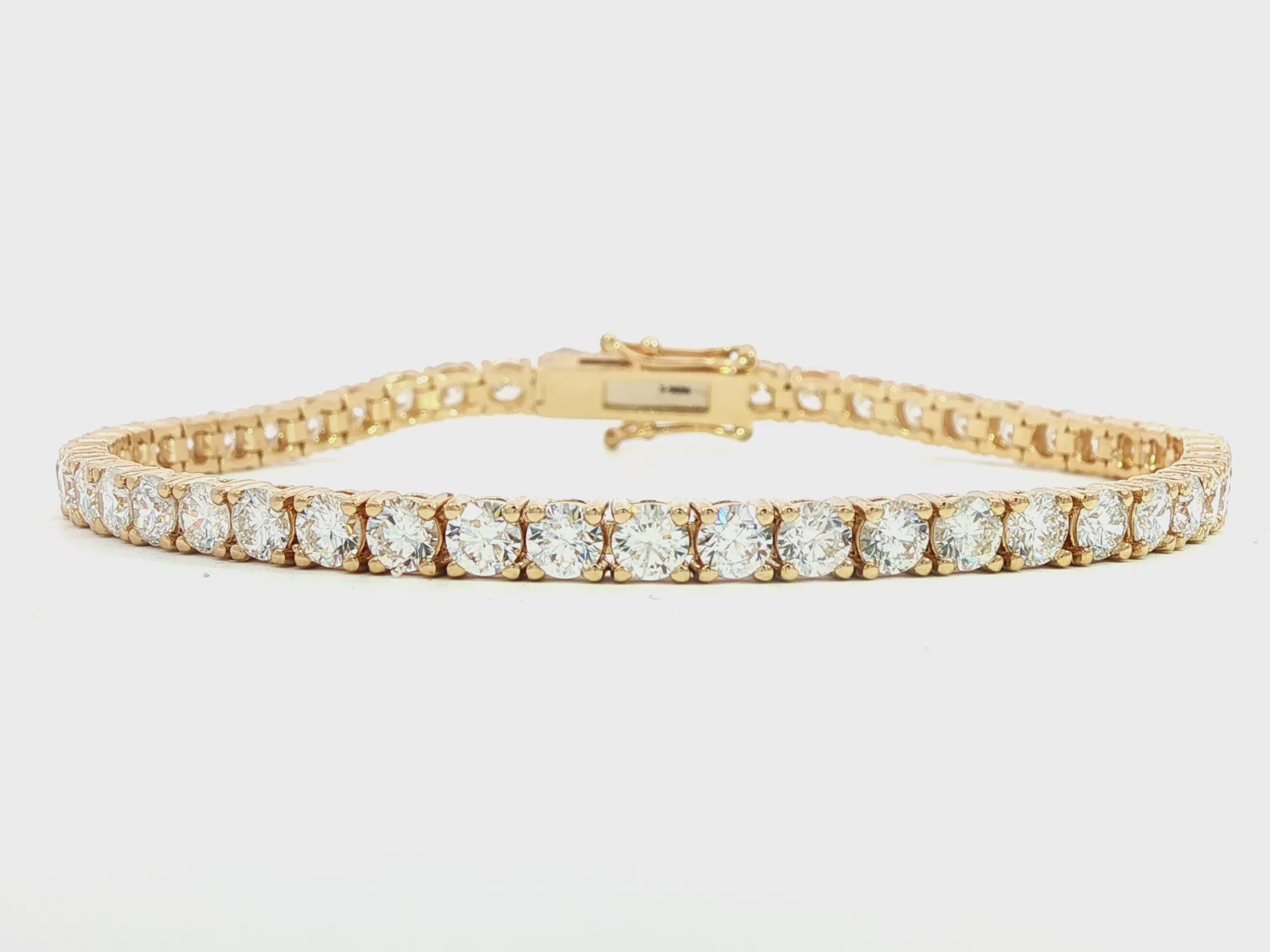 14K Yellow gold tennis bracelet set with round brilliant diamonds. Item J38986 - ABC Jewelry Co. 