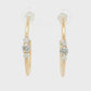 14K Yellow gold hoop earrings each set with a row of three round brilliant diamonds. Item J39217 - ABC Jewelry Co. 