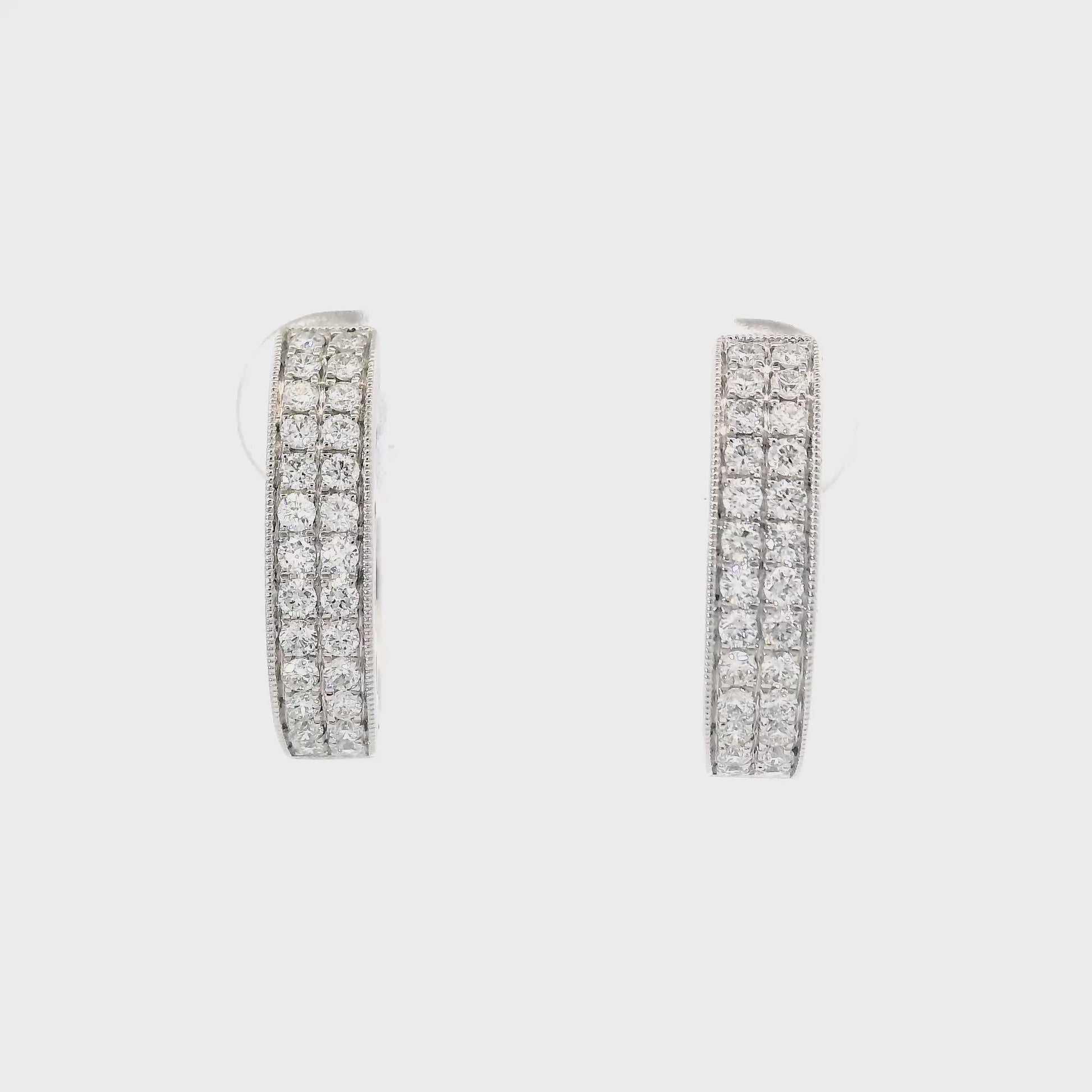 14K White gold diamond pave oval hoop earrings. Item J34762 - ABC Jewelry Co