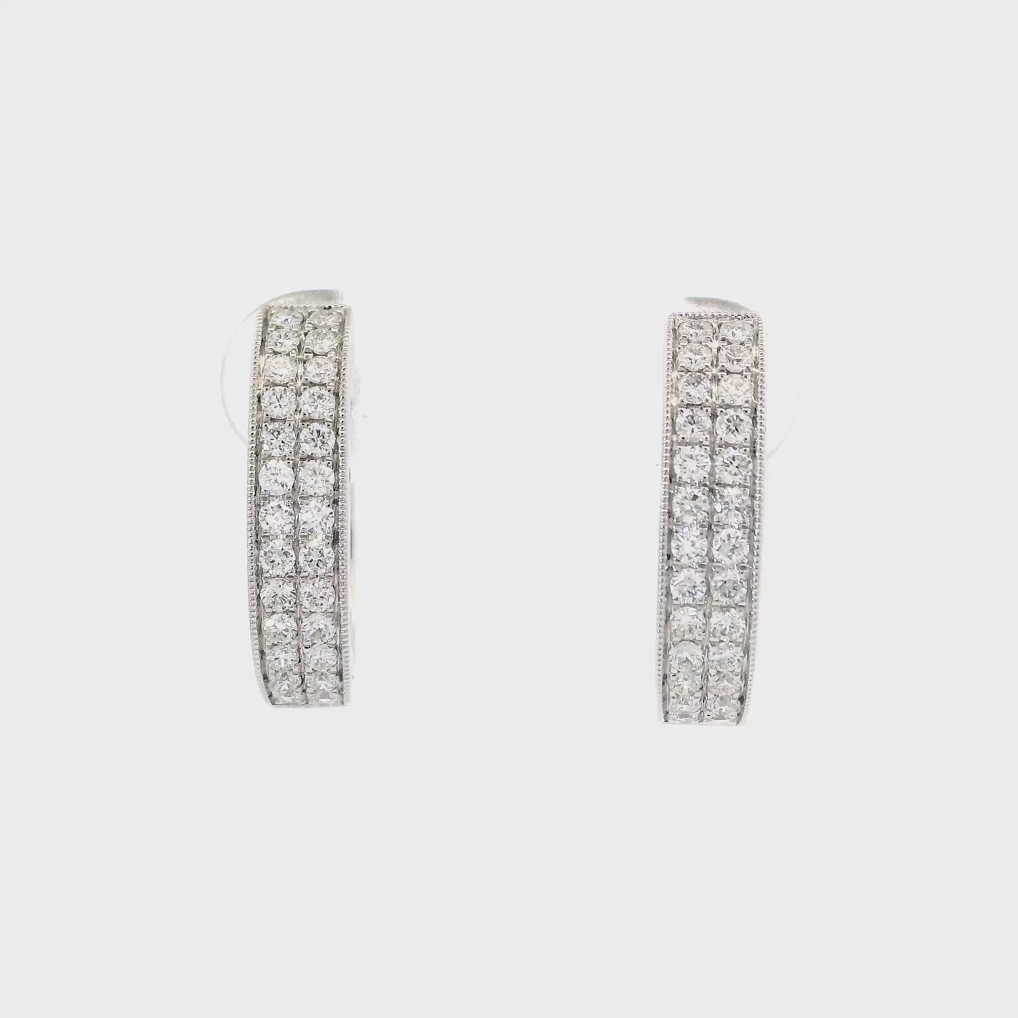 14K White gold diamond pave oval hoop earrings. Item J34762 - ABC Jewelry Co