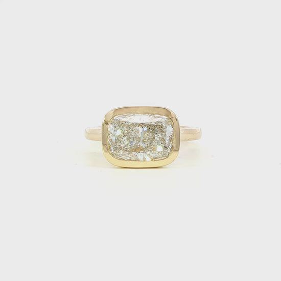 14K Yellow gold ring bezel set with a cushion cut lab grown diamond set east-west. Item J38794 - ABC Jewelry Co. 