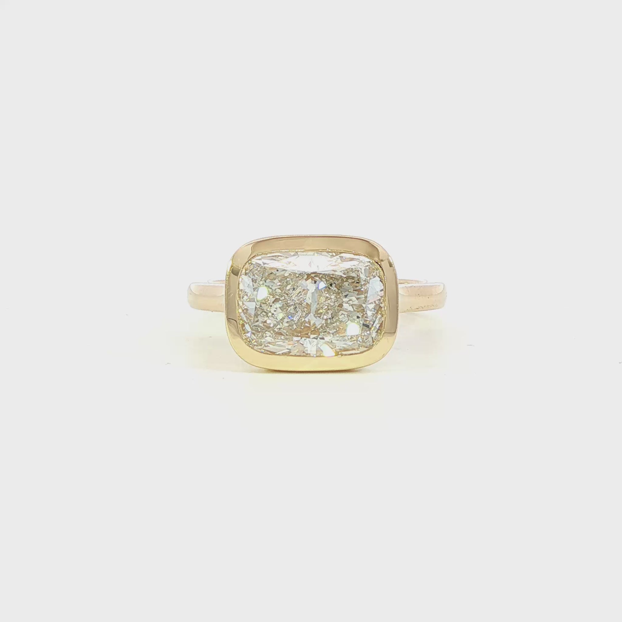 14K Yellow gold ring bezel set with a cushion cut lab grown diamond set east-west. Item J38794 - ABC Jewelry Co. 
