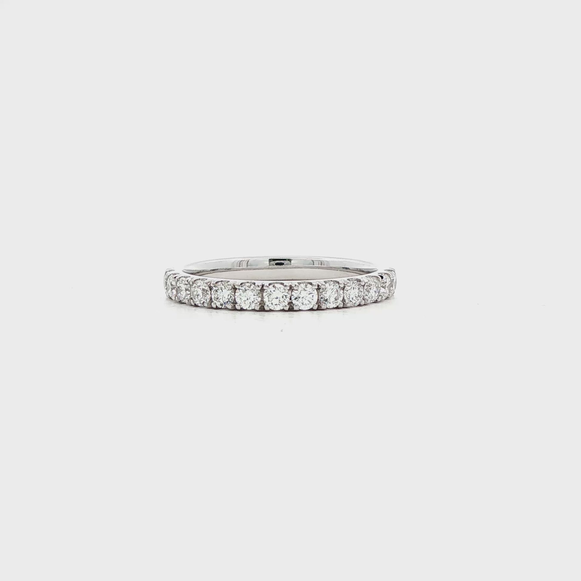 14K White gold band set with round brilliant diamonds. Item J39115 - ABC Jewelry Co.