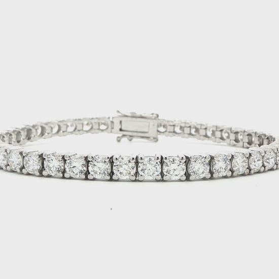 14K White gold tennis bracelet set with round brilliant diamonds. Item J38985 - ABC Jewelry Co