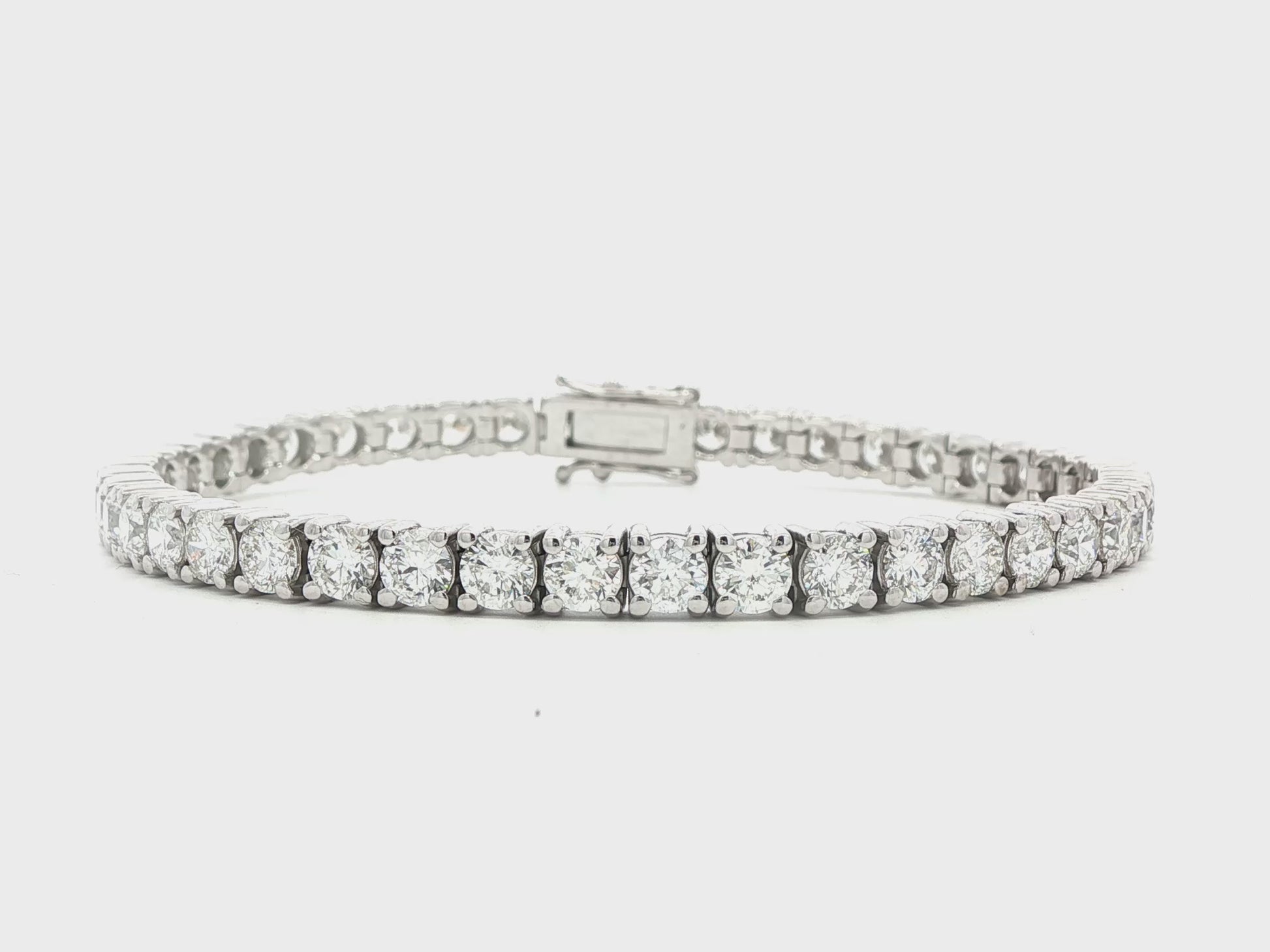 14K White gold tennis bracelet set with round brilliant diamonds. Item J38985 - ABC Jewelry Co