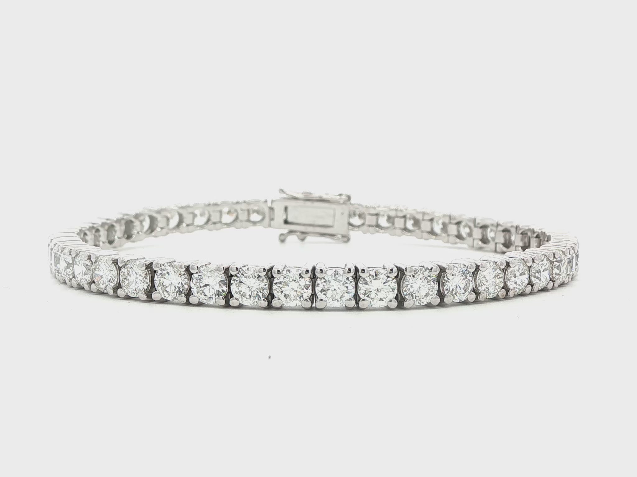 14K White gold tennis bracelet set with round brilliant diamonds. Item J38985 - ABC Jewelry Co