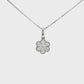 Diamond cluster pendant in floral design, set with round brilliant diamonds. Item J30348 - ABC Jewelry Co.