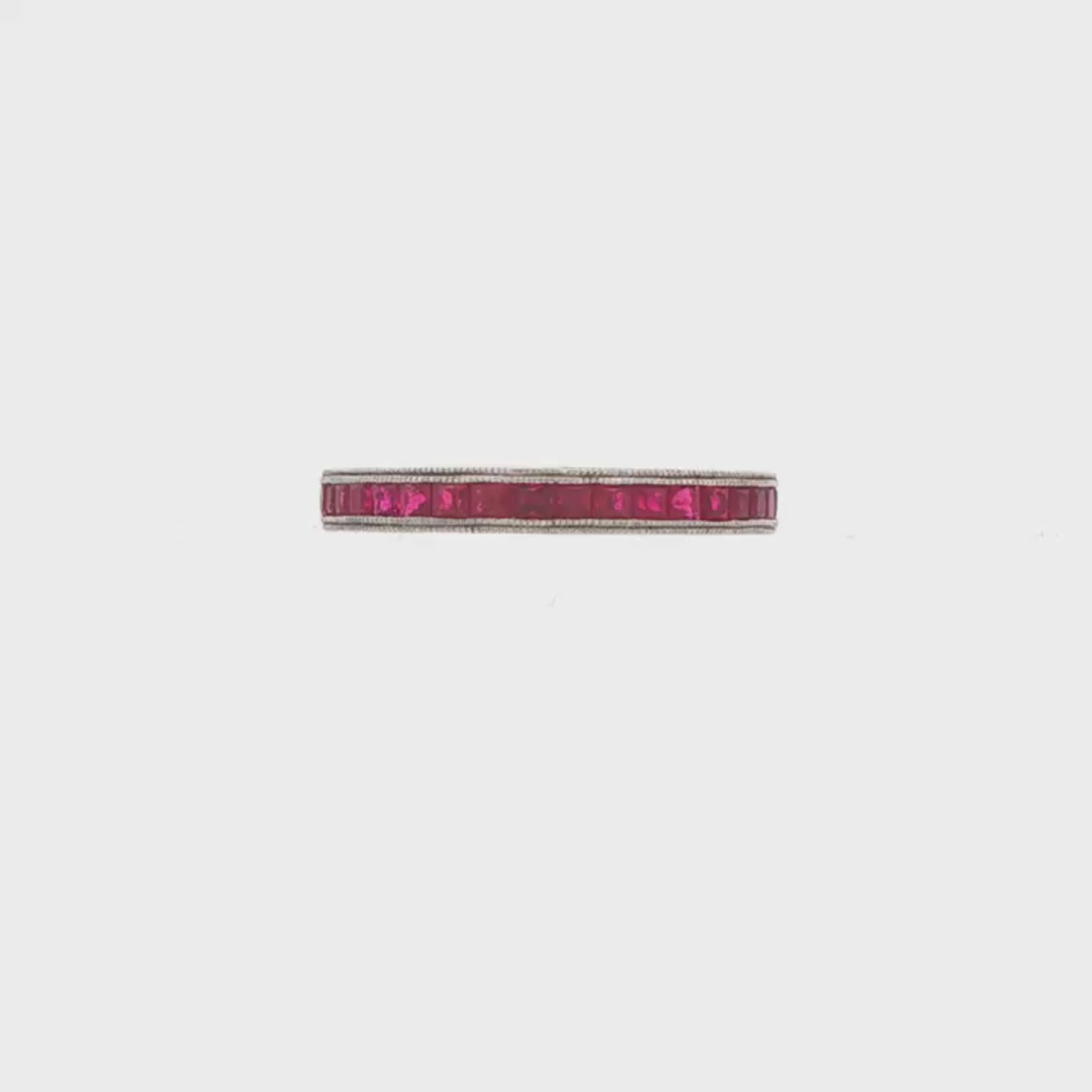 18K White gold eternity band set with princess cut rubies. Item 23024 - ABC Jewelry Co.