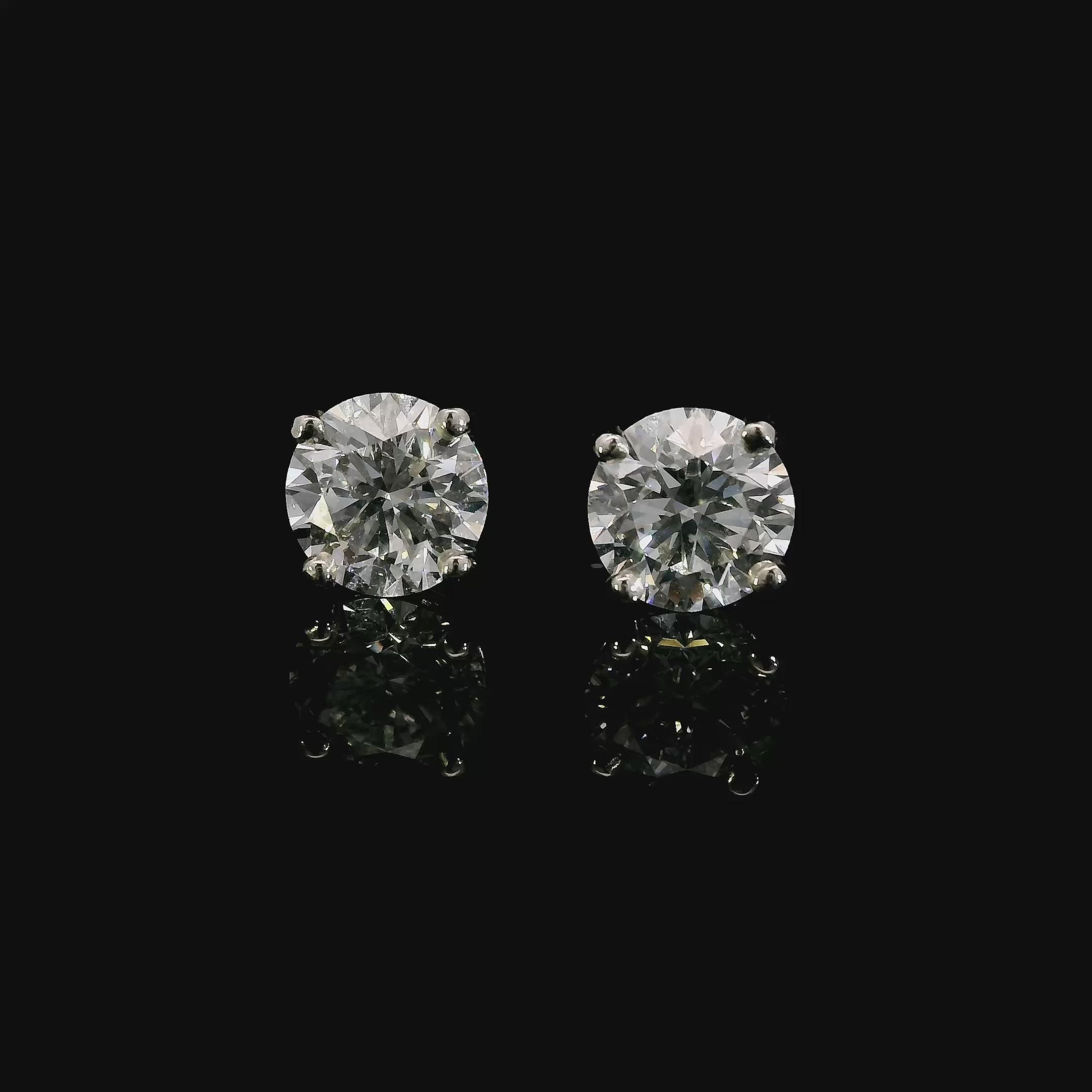 14K White gold studs set with round brilliant diamonds. Item J37908 - ABC Jewelry Co. 