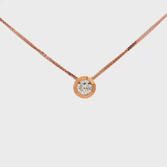 14K Rose gold solitaire necklace set with a round brilliant diamond. Item 24495 - ABC Jewelry Co