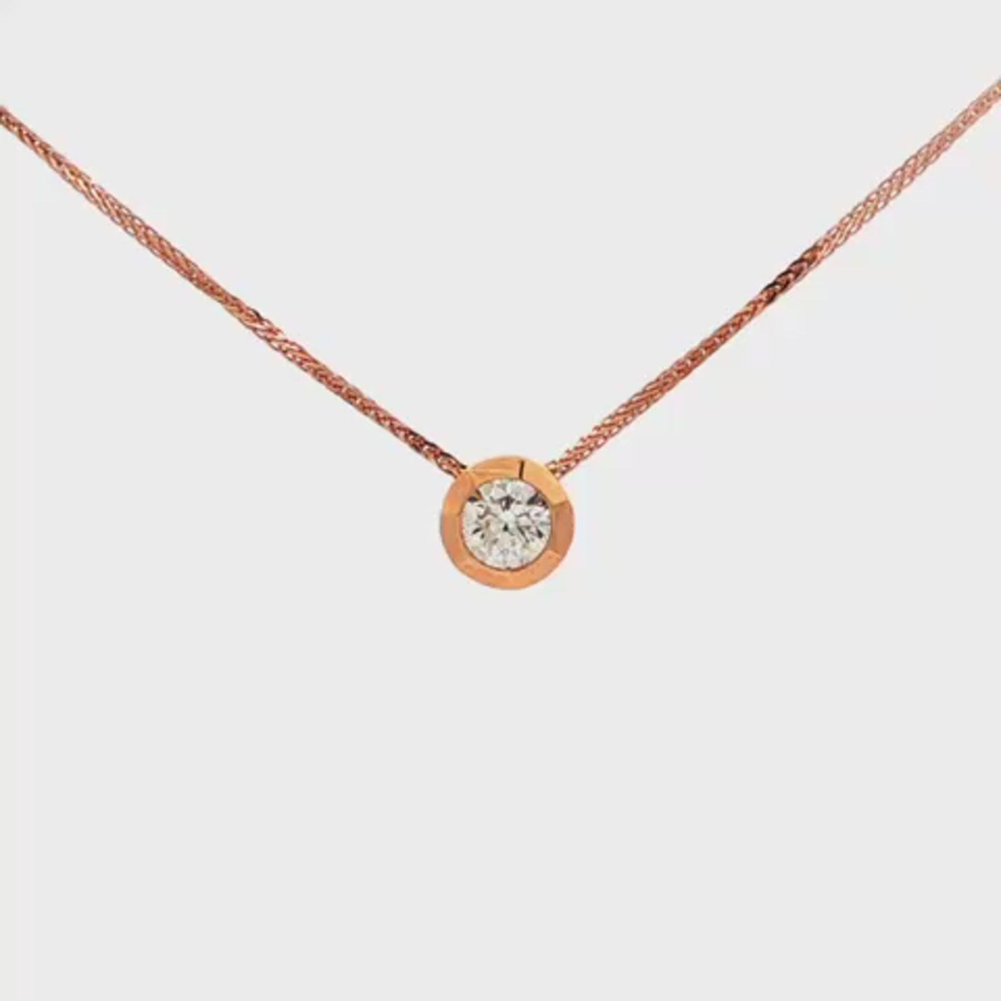 14K Rose gold solitaire necklace set with a round brilliant diamond. Item 24495 - ABC Jewelry Co