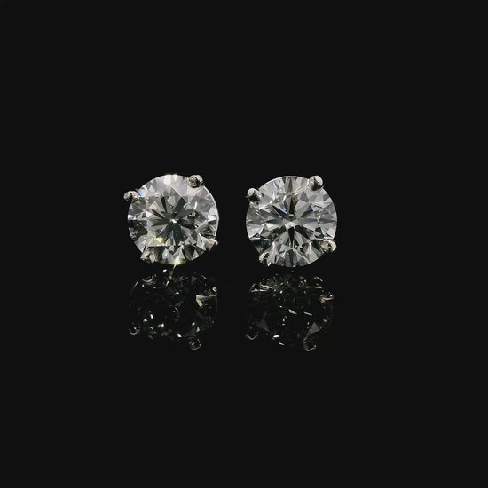 14K White gold studs set with round brilliant diamonds. Item J38705 - ABC Jewelry Co. 