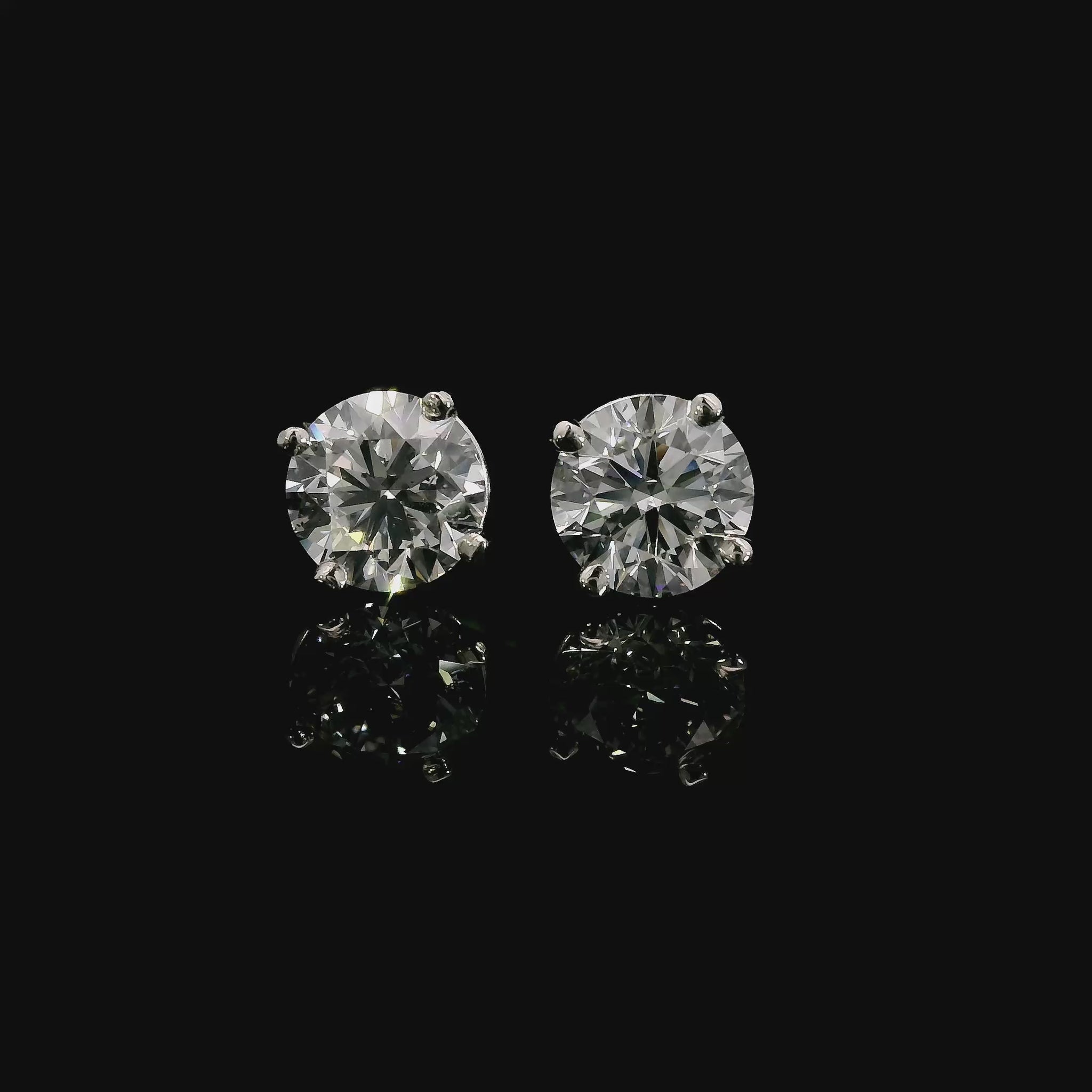 14K White gold studs set with round brilliant diamonds. Item J38705 - ABC Jewelry Co. 