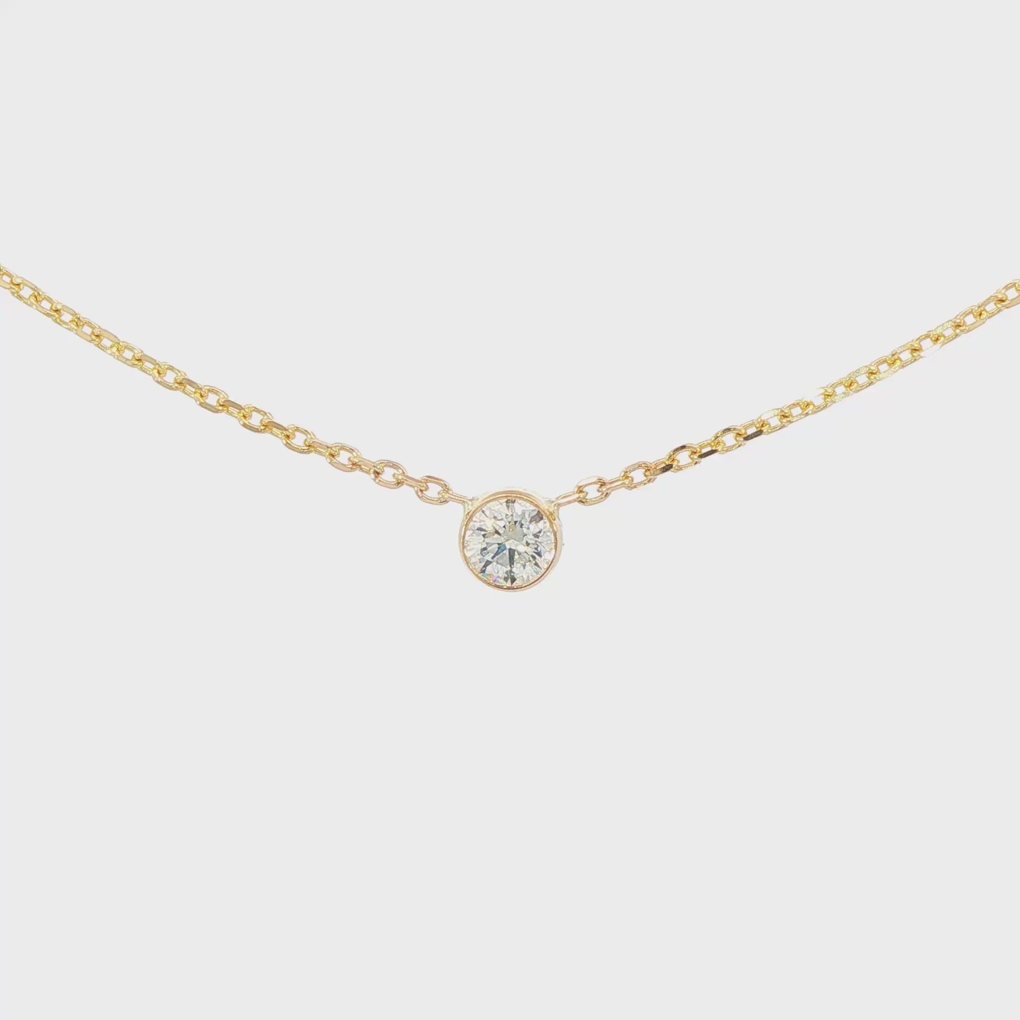 14K Yellow gold necklace with one bezel set round brilliant diamond. Item J38629 - ABC Jewelry Co. 
