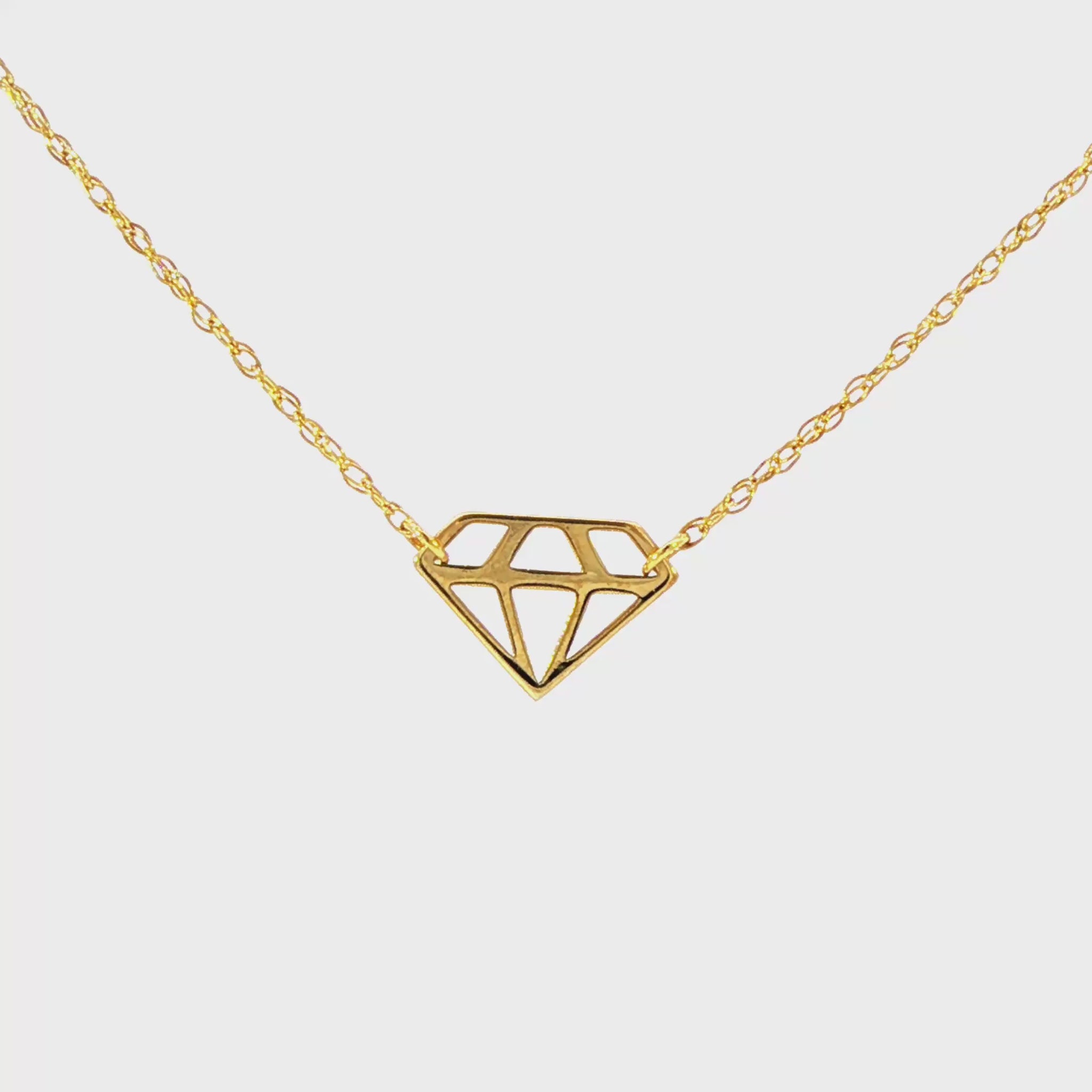 14K Yellow gold necklace with diamond silhouette pendant. Item J32590 - ABC Jewelry Co.