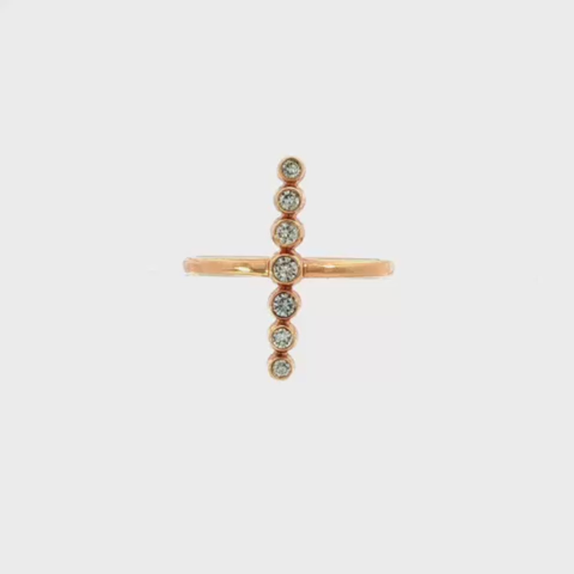 14K Rose gold ring with a vertical bar of bezel set diamonds. Item J31309 - ABC Jewelry Co. 