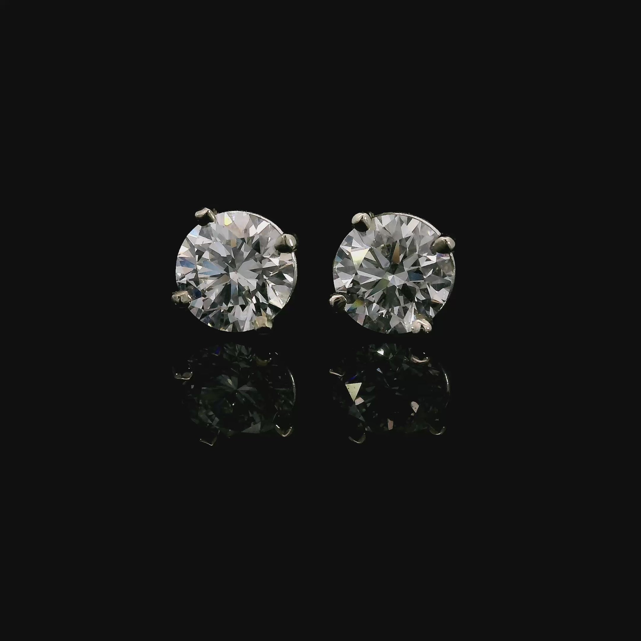 14K White gold studs set with round brilliant diamonds. Item J38143 - ABC Jewelry Co. 