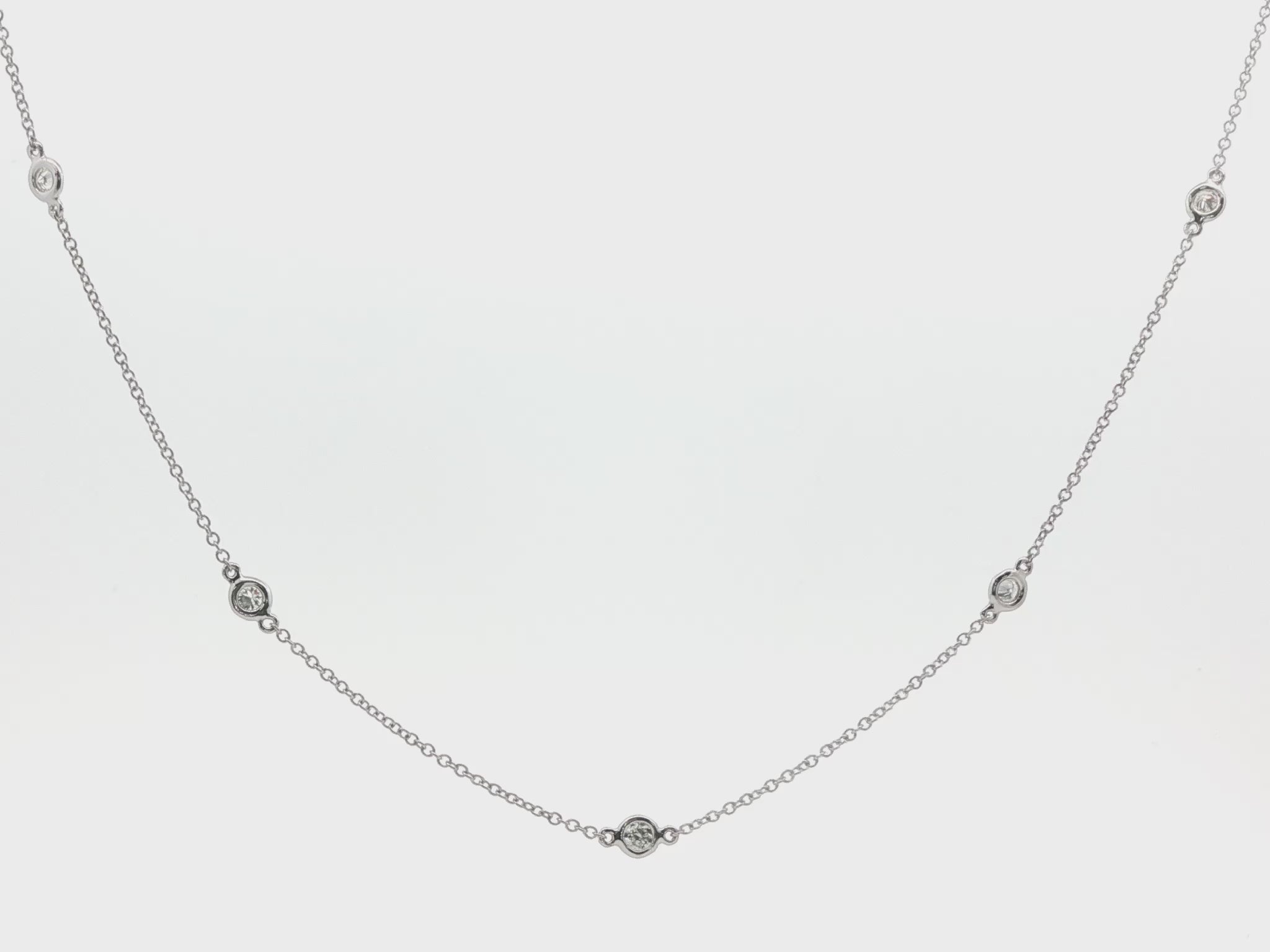 18K White gold necklace with bezel set diamonds bezel set along the chain. Item J38857 - ABC Jewelry Co. 