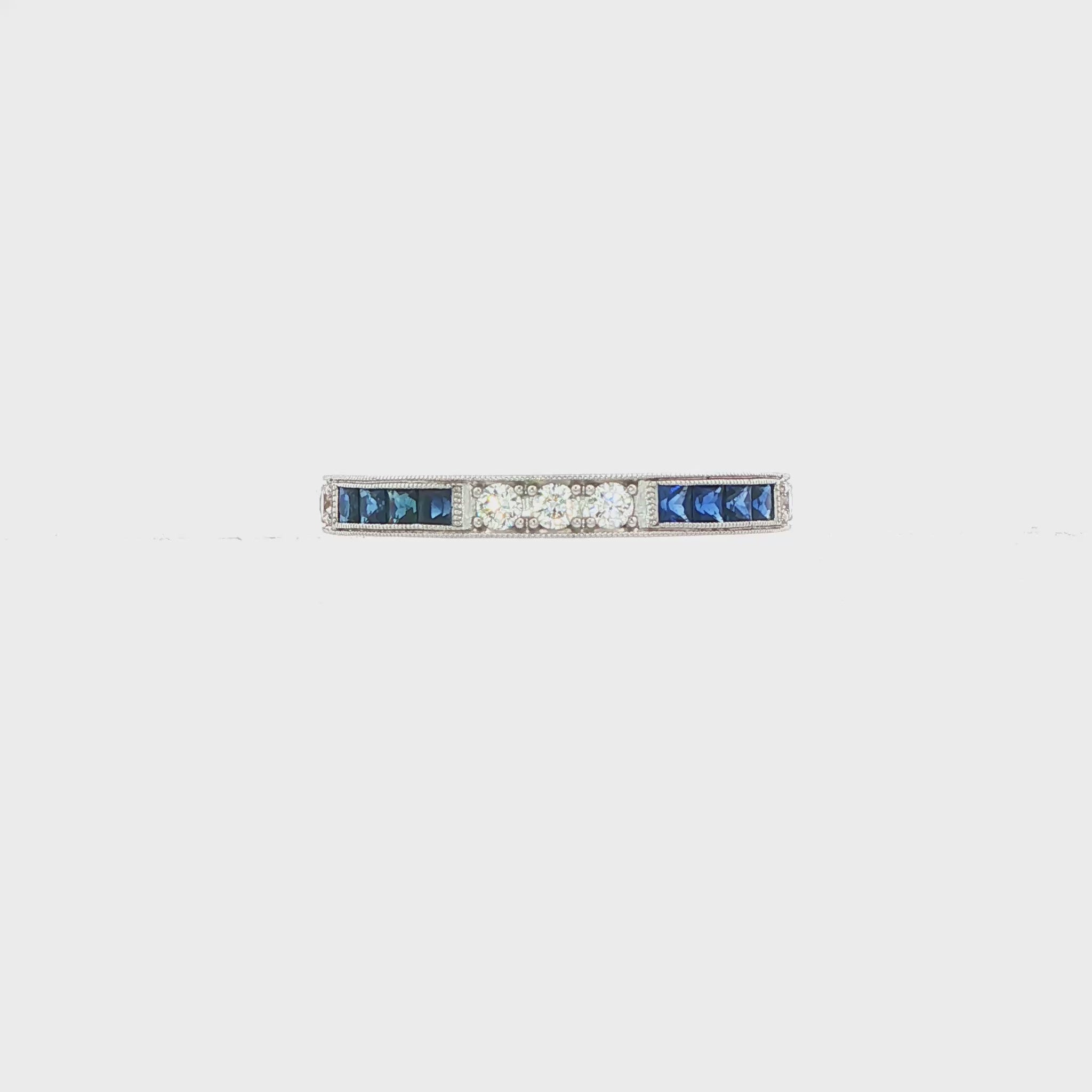 18K White gold eternity band set with princess set blue sapphires and round brilliant diamonds. Item J37387 - ABC Jewelry Co. 