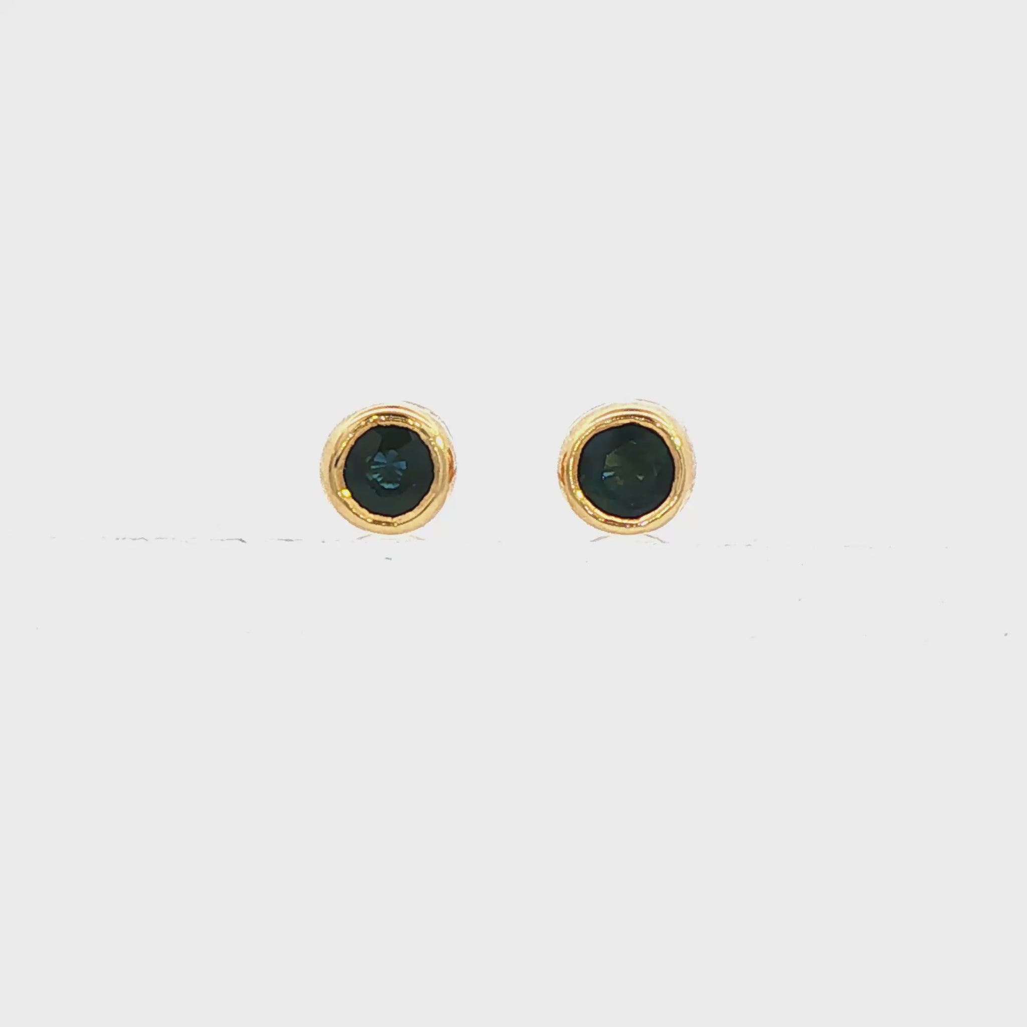 14K Yellow gold bezel set blue sapphire stud earrings. Item 3595 - ABC Jewelry Co. 