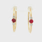 14K Yellow gold hoop earrings, each set with a round ruby flanked by two round diamonds. Item - J39018 - ABC Jewelry Co. 