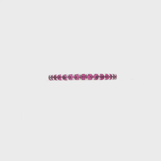 14K White gold eternity band set with pink sapphires. Item 9236 - ABC Jewelry Co.
