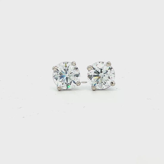 14K White gold diamond stud earrings. Item J38704 - ABC Jewelry Co.