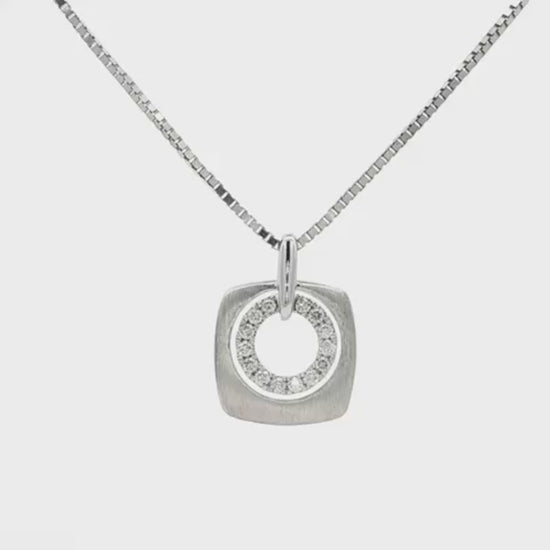 14K White gold pendant with inner circle of diamonds. Item 22607 - ABC Jewelry Co.