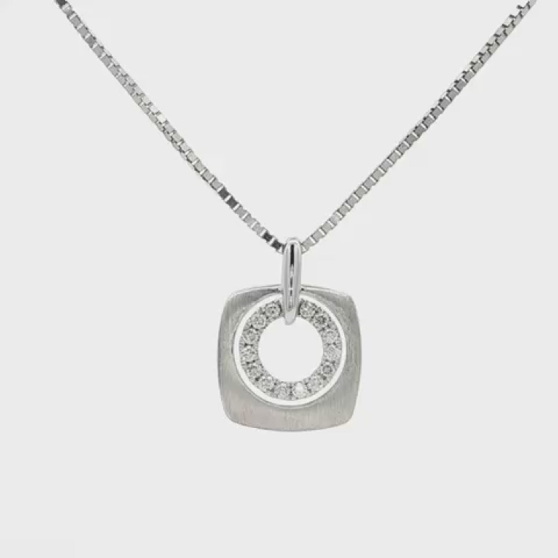 14K White gold pendant with inner circle of diamonds. Item 22607 - ABC Jewelry Co.
