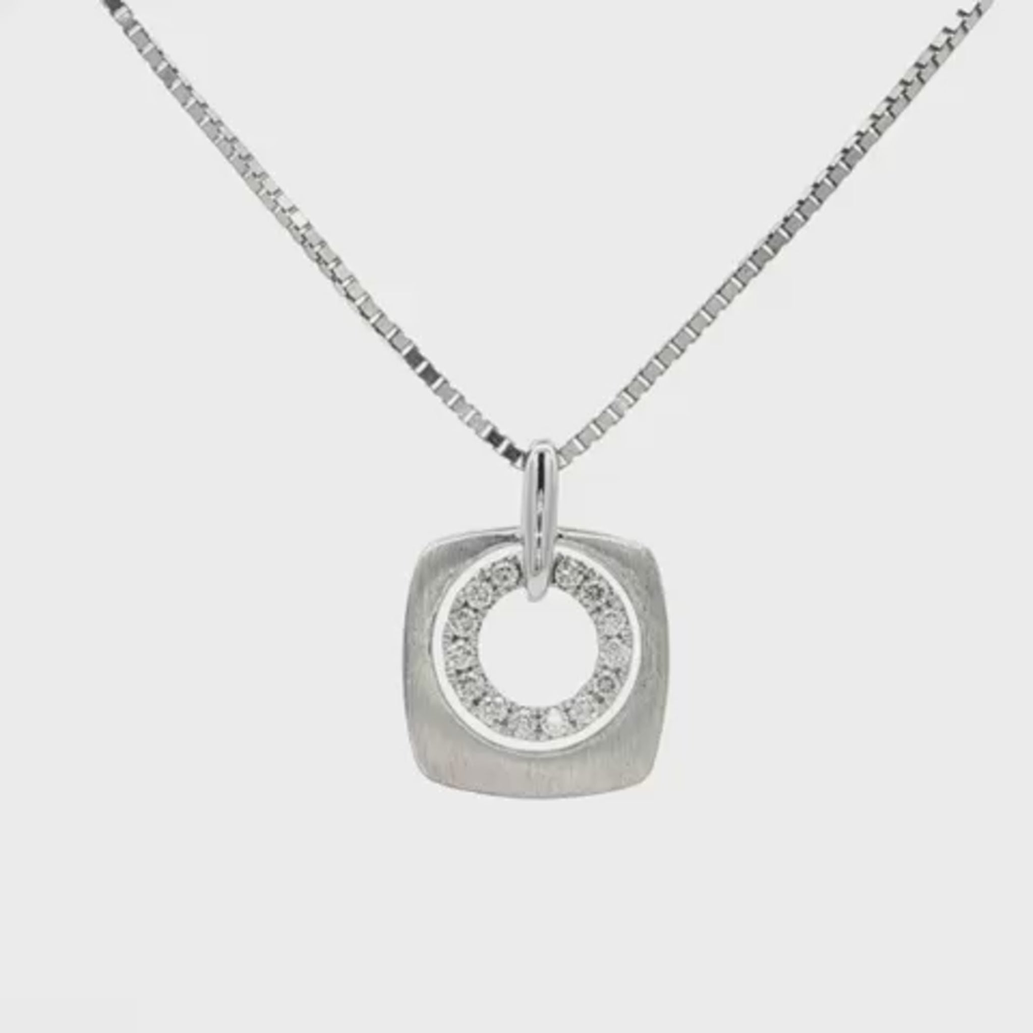 14K White gold pendant with inner circle of diamonds. Item 22607 - ABC Jewelry Co.