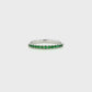 18K White gold band set with round green emeralds. Item J36909 - ABC Jewelry Co