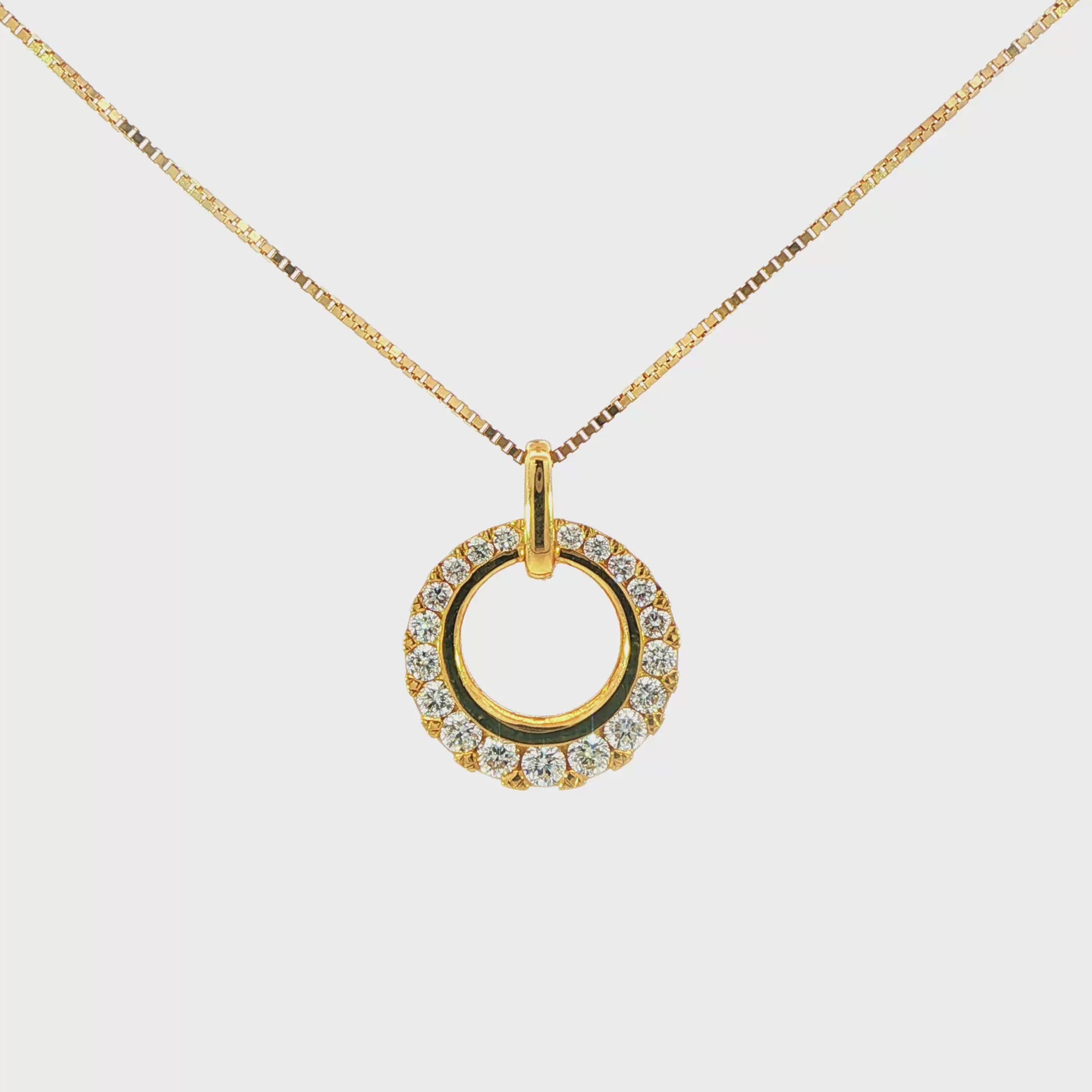 18K Yellow gold circular pendant set with round brilliant diamonds graduating in size. Item J36228 - ABC Jewelry Co. 