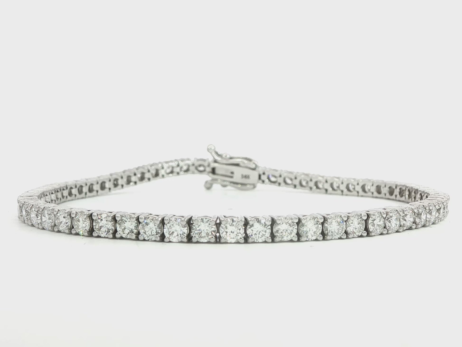 14K White gold tennis bracelet set with round brilliant diamonds. Item J38810 - ABC Jewelry Co