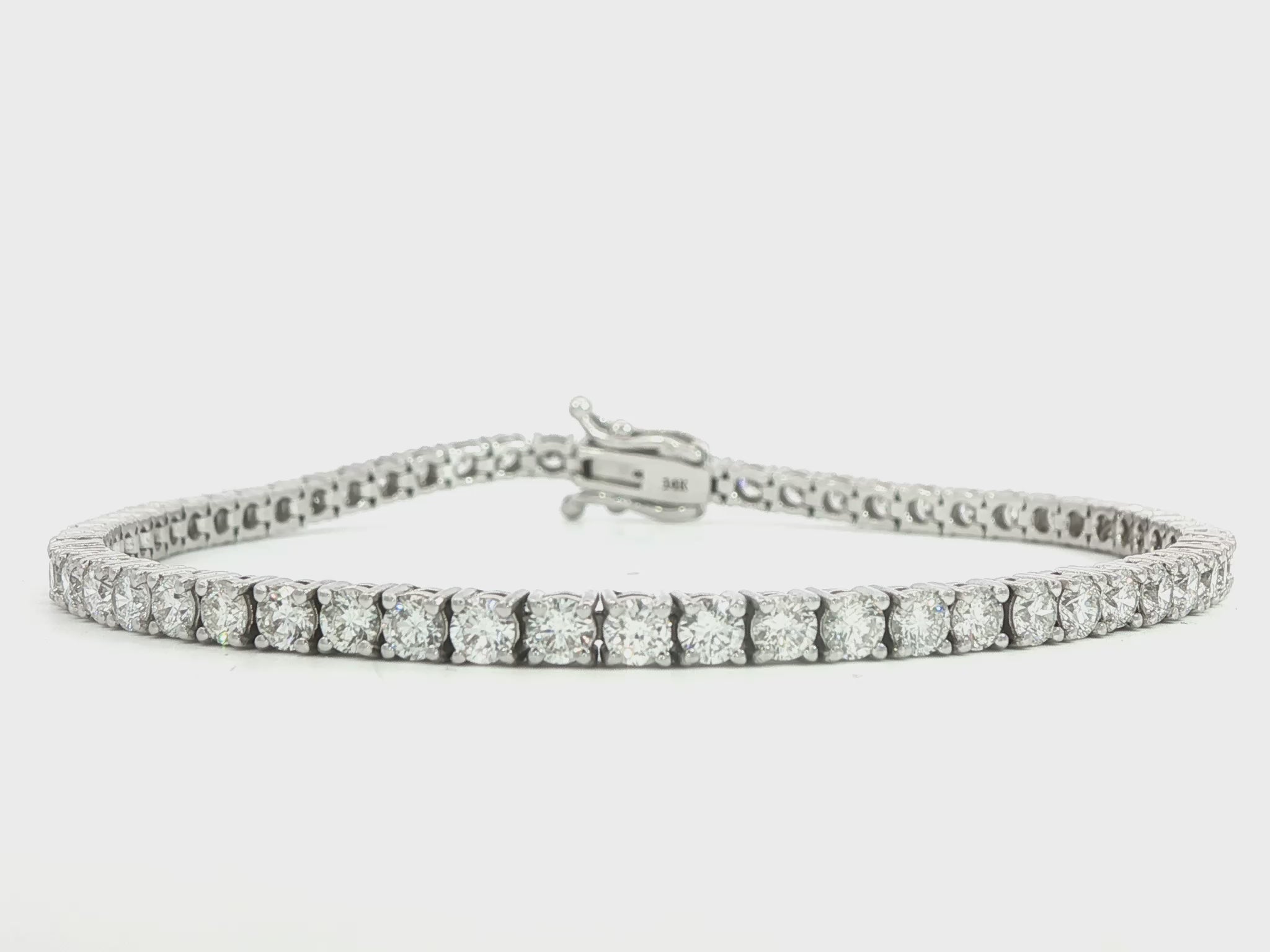 14K White gold tennis bracelet set with round brilliant diamonds. Item J38810 - ABC Jewelry Co