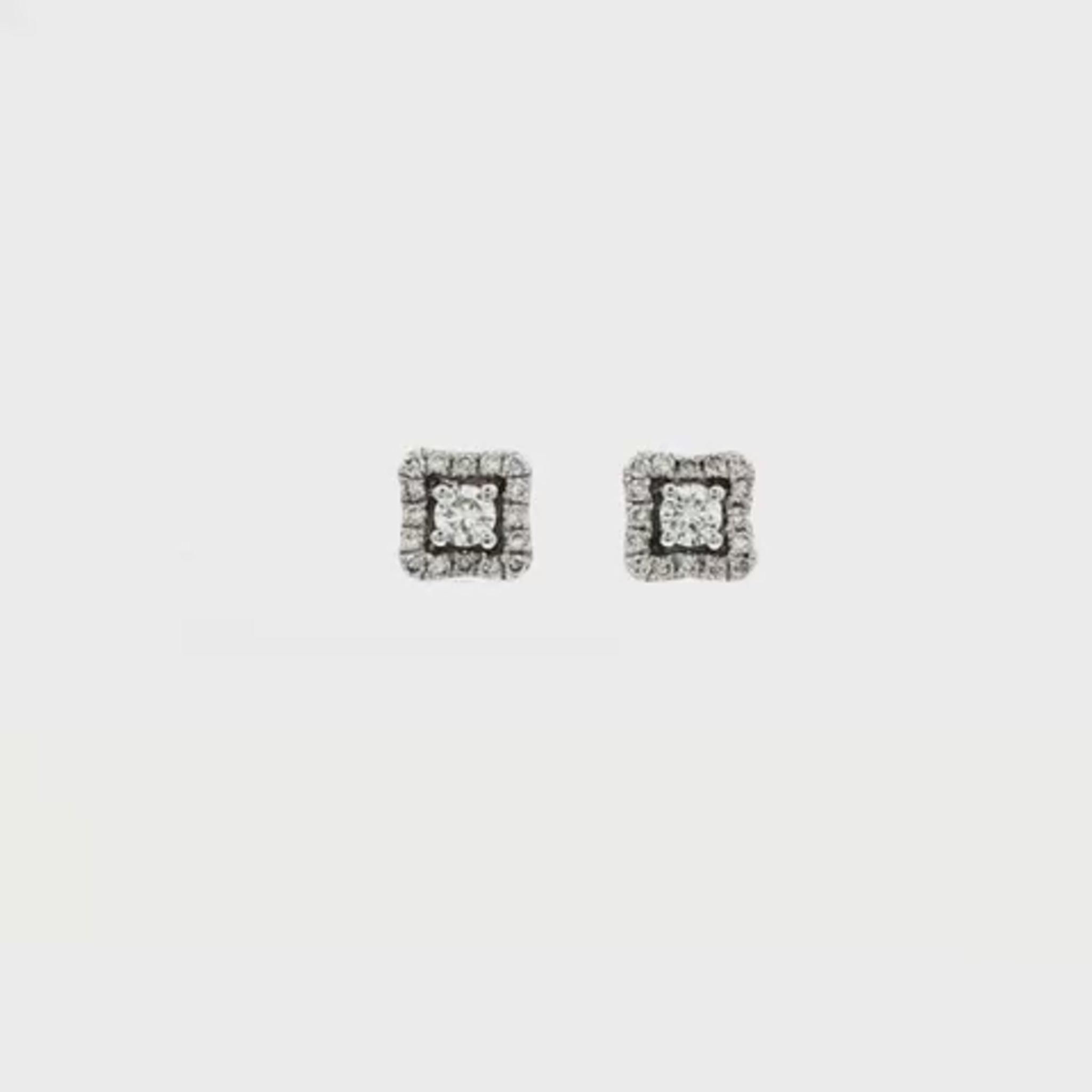 14K White gold diamond earrings set with a round brilliant center and square halo of round diamonds. Item 24903 - ABC Jewelry Co.