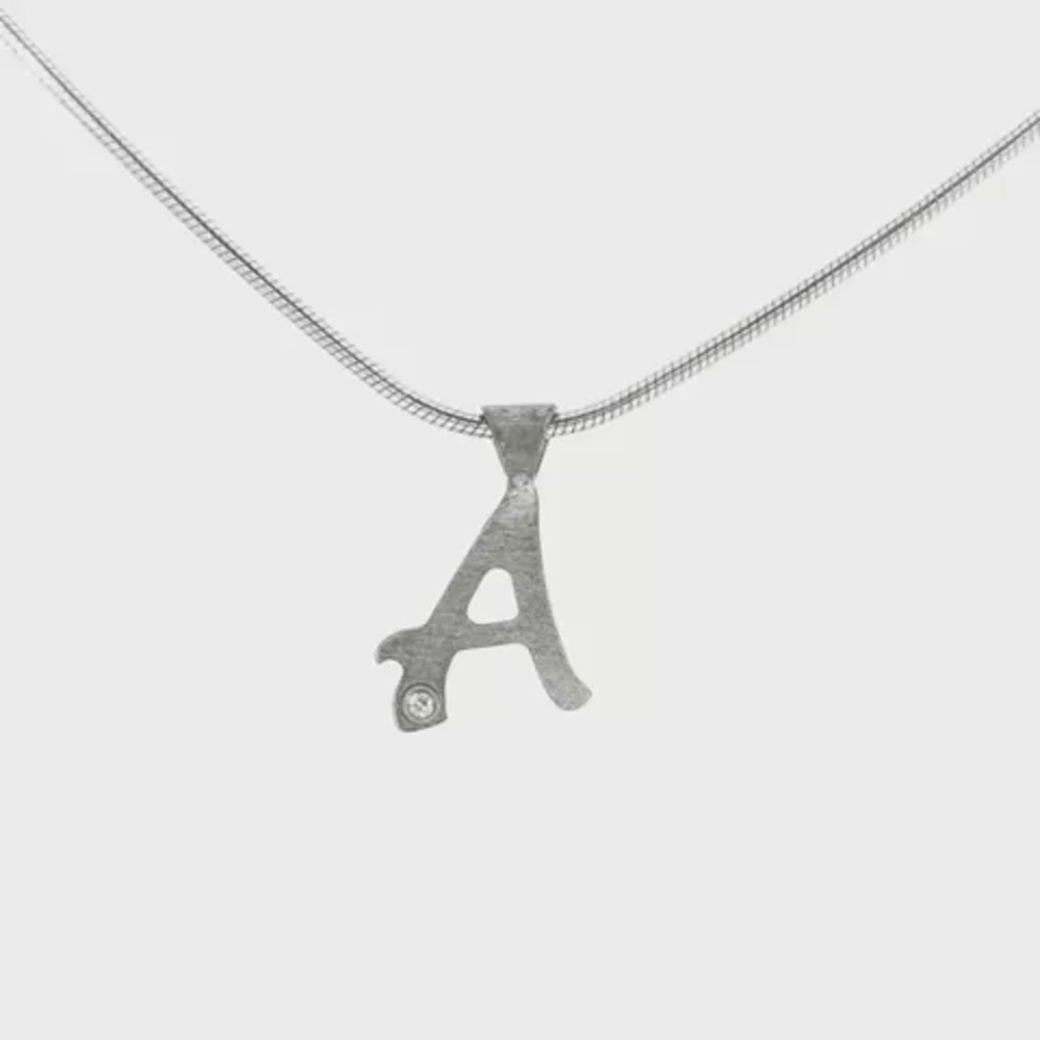 Sterling silver necklace with initial "A" pendant, set with 1 round brilliant diamond. Item 21189 - ABC Jewelry Co.