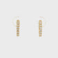 18K Yellow gold huggies set with round brilliant diamonds. Item J38843 - ABC Jewelry Co.