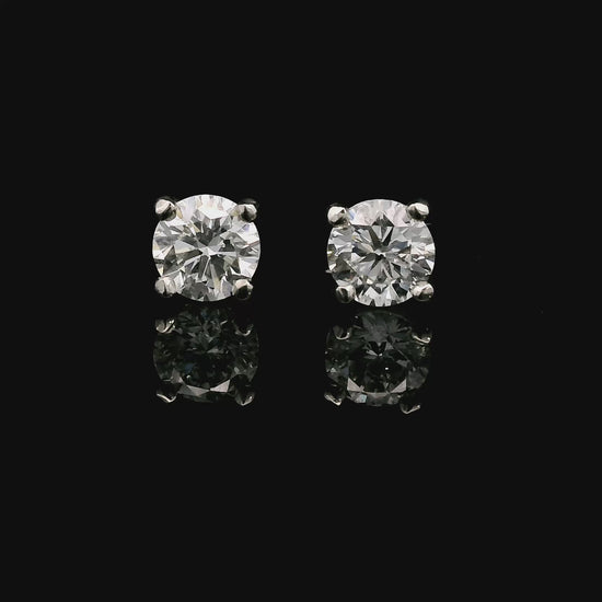 14K White gold stud earrings set with round brilliant diamonds. Item J37987 - ABC Jewelry Co. 