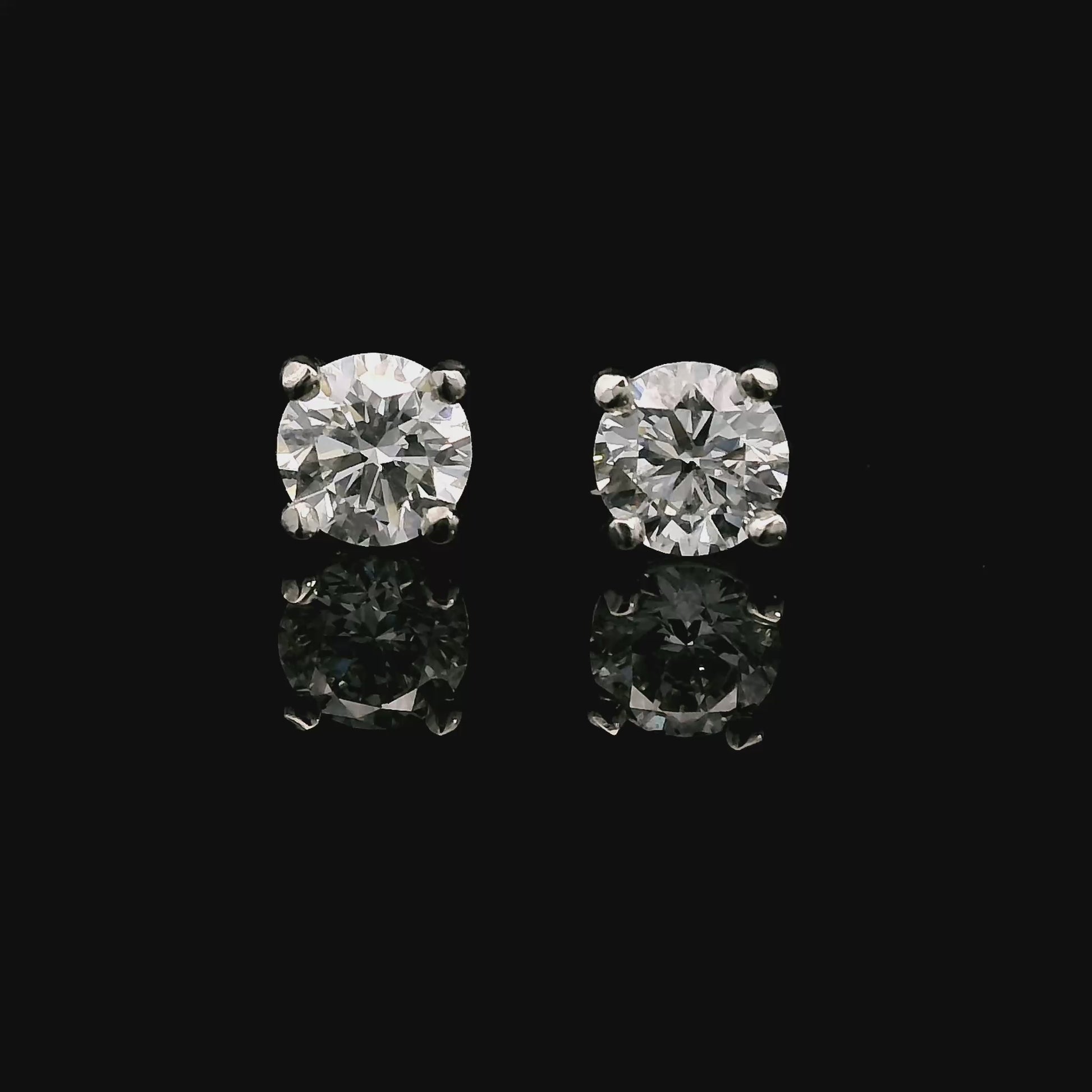 14K White gold stud earrings set with round brilliant diamonds. Item J37987 - ABC Jewelry Co. 