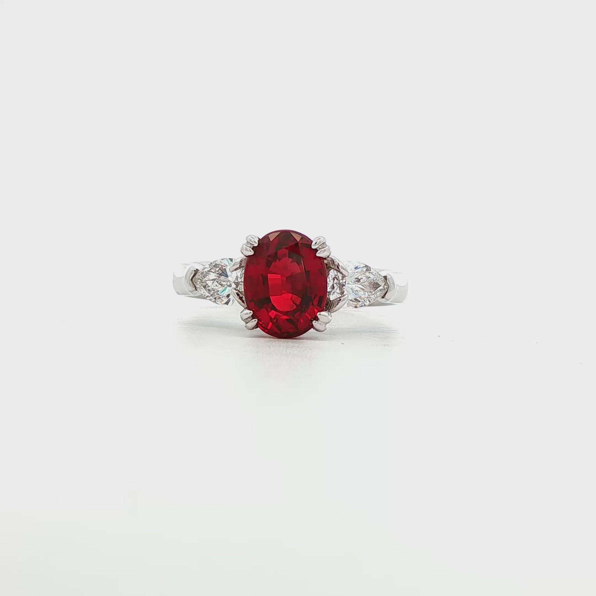 14K White gold ring with red ruby center and pear shape diamond shoulders. Item J35580 - ABC Jewelry Co. 