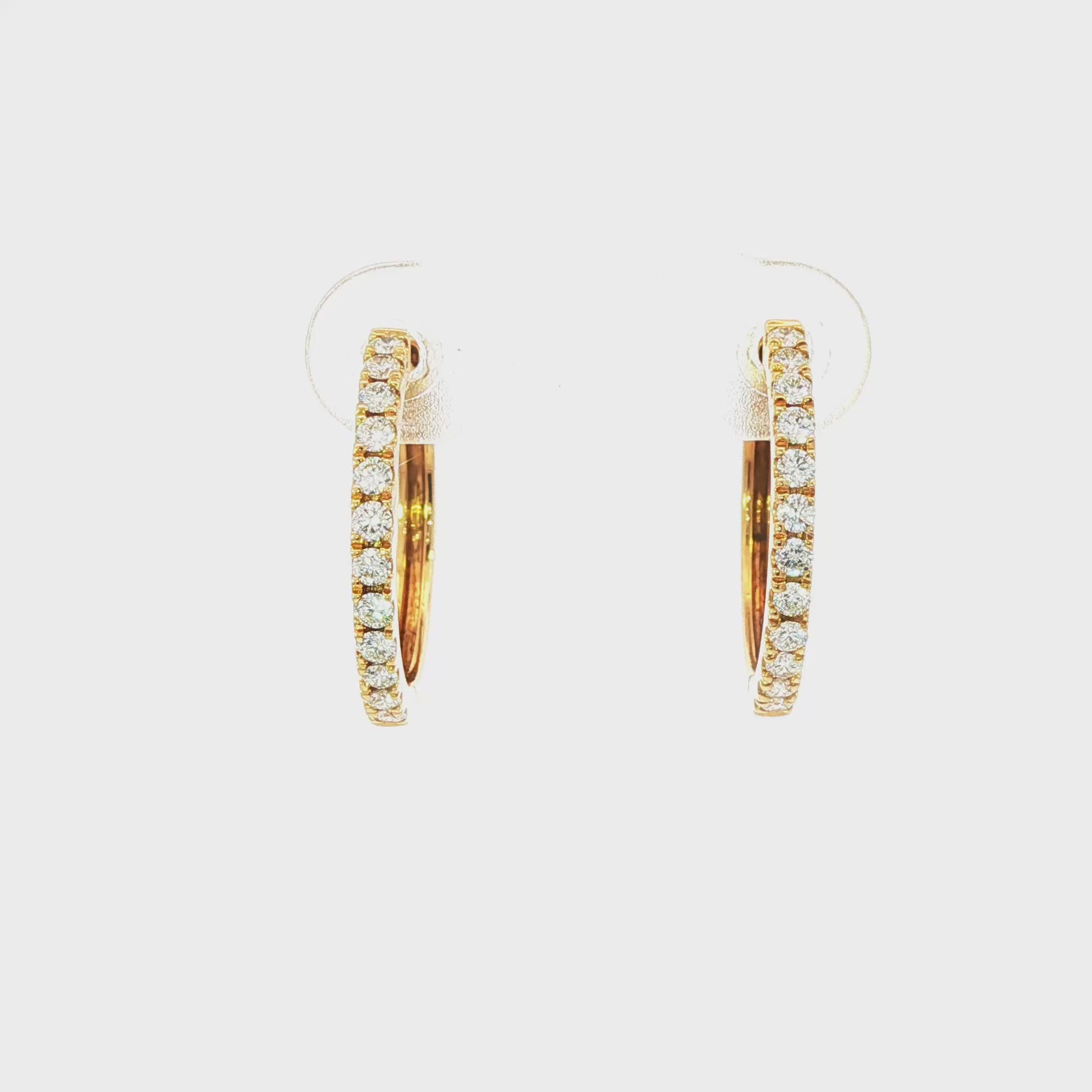 18K Yellow gold hoop earrings set with round brilliant diamonds. Item J37722 - ABC Jewelry Co.