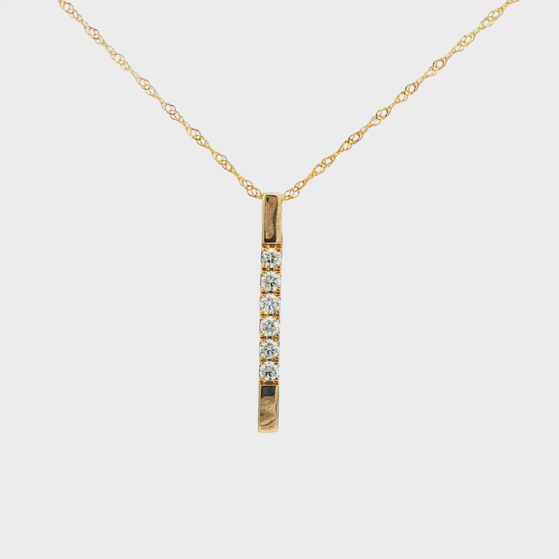 14K Yellow gold bar pendant necklace set with 6 round brilliant diamonds. Item J37535 - ABC Jewelry Co. 