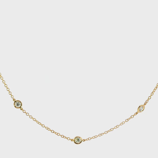 18K Yellow gold necklace with bezel set round brilliant diamonds set along the chain. Item J38856 - ABC Jewelry Co. 