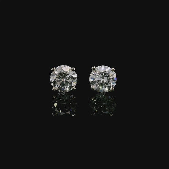 14K White gold studs set with round brilliant diamonds. Item J37952 - ABC Jewelry Co. 
